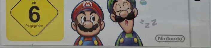 Mario & Luigi: Dream Team, the USK square on its front
